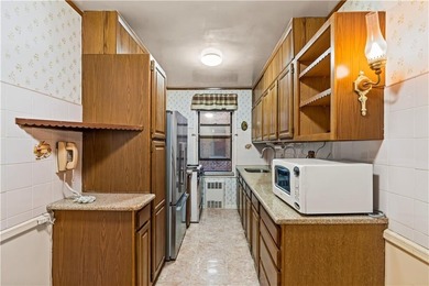 Welcome to 2465 Knapp Street #4F, a bright and beautifully lit