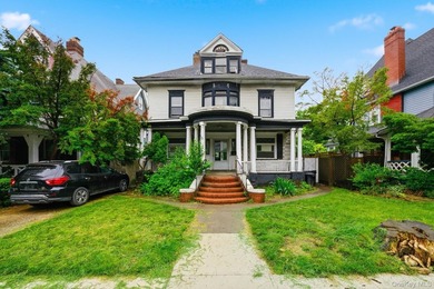 Rarely available 3-story detached colonial on a lush 50' x 100' - photo 1