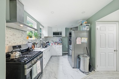 Rarely available 3-story detached colonial on a lush 50' x 100' - photo 3