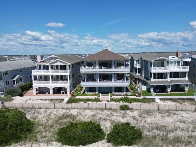This spectacular 5 bedroom, 4 full bath, 2nd floor beachfront