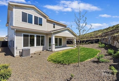Set against the Eagle Foothills, this Shea Homes Symphony floor - photo 13