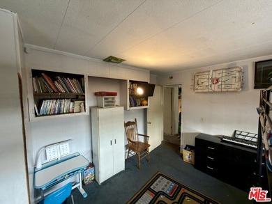 Spacious and rare 4-bedroom, 2-bath double-wide located in the - photo 16
