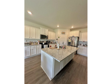 Welcome to this beautifully maintained 2022-built home located - photo 11