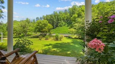 This well-known iconic white farmhouse sits proudly in the heart - photo 11