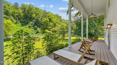 This well-known iconic white farmhouse sits proudly in the heart - photo 12