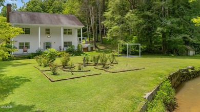 This well-known iconic white farmhouse sits proudly in the heart - photo 25