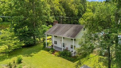 This well-known iconic white farmhouse sits proudly in the heart - photo 46