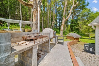 This well-known iconic white farmhouse sits proudly in the heart - photo 52