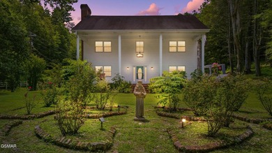 This well-known iconic white farmhouse sits proudly in the heart - photo 54