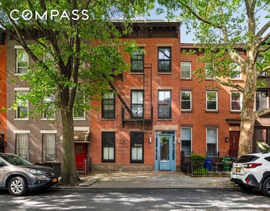 192 Nelson Street is a warm and welcoming three-family townhouse - photo 1