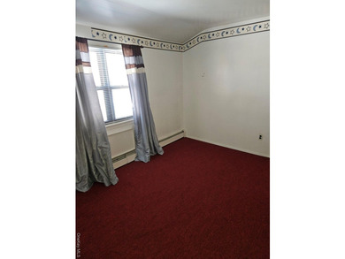 Nicely maintained 2 family home with wood floors. 1st floor has - photo 12