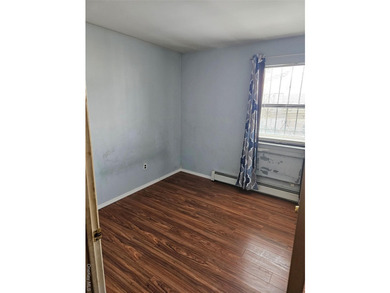 Nicely maintained 2 family home with wood floors. 1st floor has - photo 23