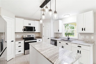 Move right into this beautifully updated 4-bedroom (plus an - photo 5