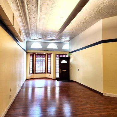 This beautiful downtown building still has original brick work - photo 19