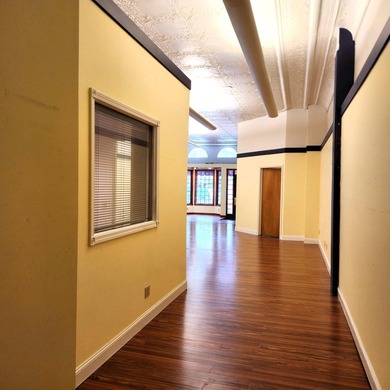 This beautiful downtown building still has original brick work - photo 20
