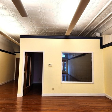 This beautiful downtown building still has original brick work - photo 21