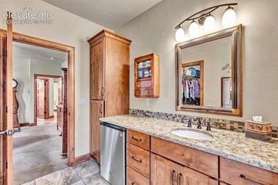 This exceptional residence, tucked behind the private gates of - photo 20