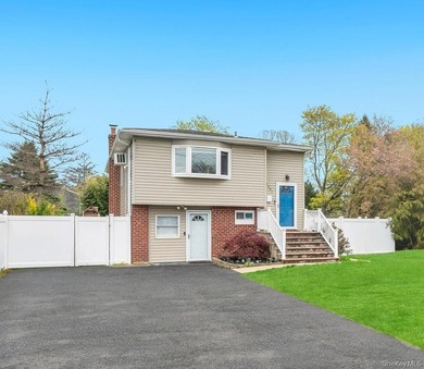 Welcome to this beautifully updated Hi-Ranch located in the - photo 2