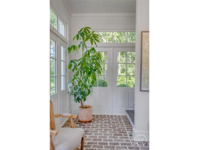 Tucked gracefully into its surroundings, and overlooking the - photo 11