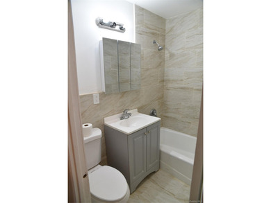 Baychester Area Updated 2 Family Brick attached Home with a - photo 25