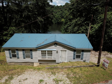 Waterfront home with a dock in Fentress Hideout! - photo 1