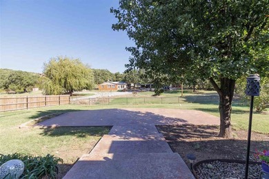 This cozy Medicine Park home has it all: Serene views of the - photo 13