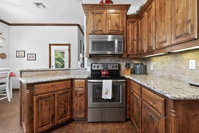 This cozy Medicine Park home has it all: Serene views of the - photo 21