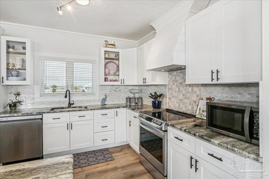 Experience sweeping waterfront views along 97 feet of pristine - photo 11