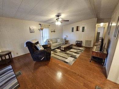 2-bedroom 2-bath home is located on a corner lot. Hardwood - photo 3