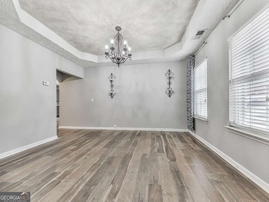 Lake & Golf Cart Living! This beautiful, spacious home offers 5