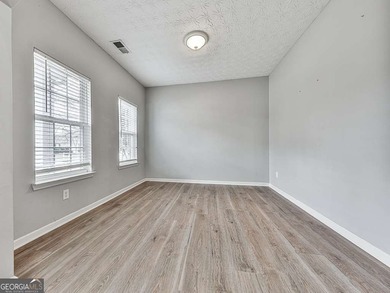 Lake & Golf Cart Living! This beautiful, spacious home offers 5