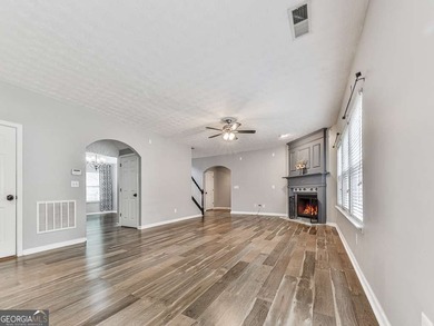 Lake & Golf Cart Living! This beautiful, spacious home offers 5