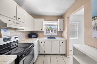 Virtually Staged. Two-bedroom condominium on the top floor with - photo 6