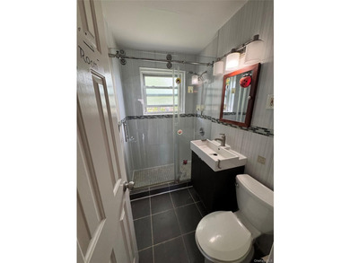 Move right into a SOUTH-facing, fully renovated, spacious, and - photo 8