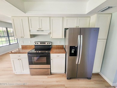 Welcome to this updated 3-bedroom, 2-bath home in Northwest Palm - photo 18