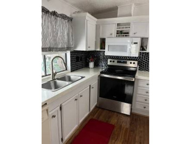 Welcome to this well kept 2 bedroom, 2 bathroom manufactured - photo 29