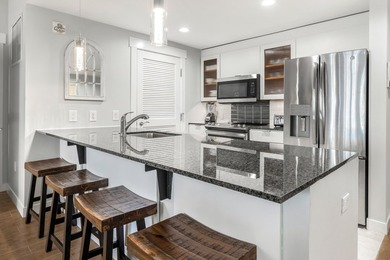 Second-floor bayfront condo with elevated positioning that - photo 6