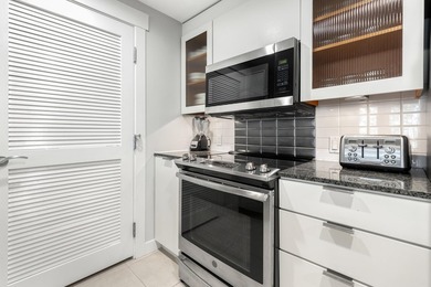 Second-floor bayfront condo with elevated positioning that - photo 8
