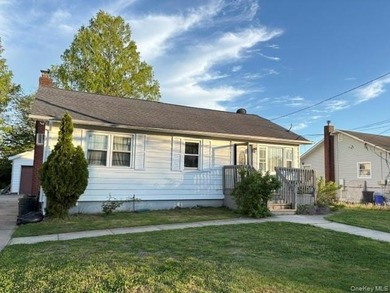 The home features a large driveway, a two-car garage, stainless - photo 2