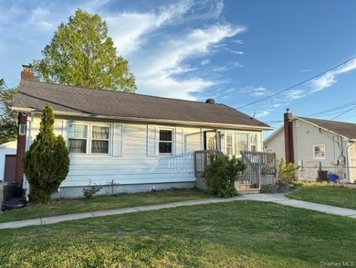 The home features a large driveway, a two-car garage, stainless - photo 3