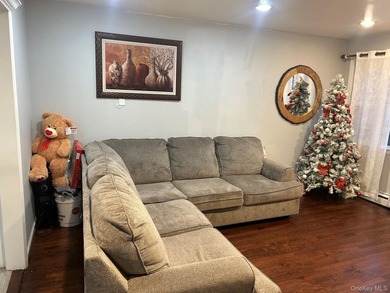 The home features a large driveway, a two-car garage, stainless - photo 4