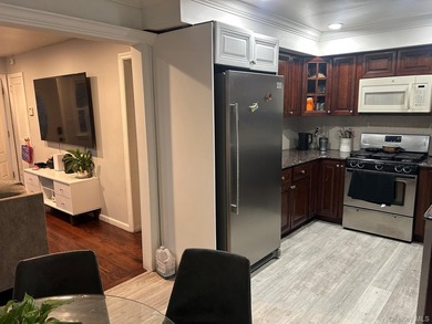 The home features a large driveway, a two-car garage, stainless - photo 7