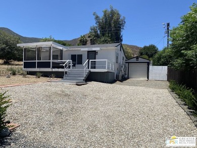 This lake view 3-bedroom, 2-bath home sits on a generous 50' x - photo 2