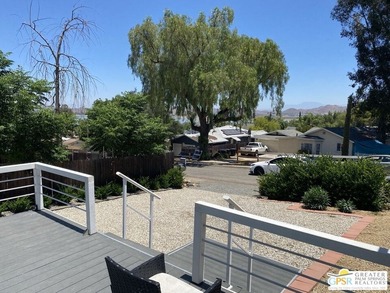 This lake view 3-bedroom, 2-bath home sits on a generous 50' x - photo 4