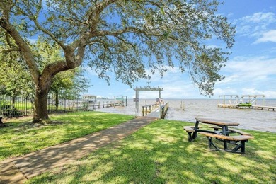 Discover Pelican Bay's Bayfront community, a serene, gated - photo 1