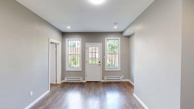 Fully renovated, legal three family delivered vacant with - photo 4