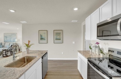 The Cali is an attractive one-story home with a spacious two-car - photo 8