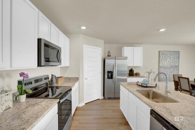 The Cali is an attractive one-story home with a spacious two-car - photo 10