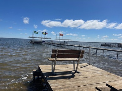 Nestled on the picturesque west shore of Houghton Lake, the - photo 11