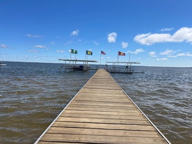 Nestled on the picturesque west shore of Houghton Lake, the - photo 12